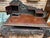 Bold dragon carving gives this wooden writing desk a striking presence. A sweeping dragon crest rises above swirling...