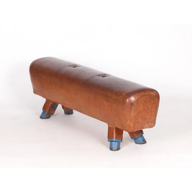 The legs were shortened to a seat height of 54cm. The thick old cowhide has been cleaned and preserved and has a very...