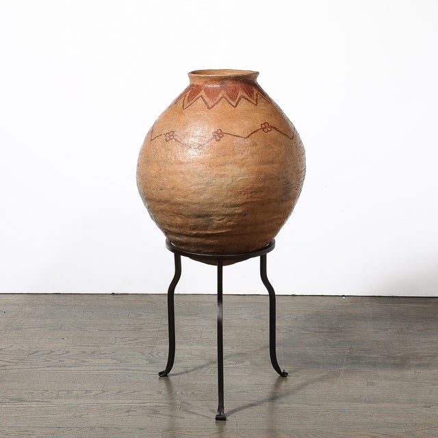 This striking 20th-century Native American tribal vessel showcases the artistry and cultural heritage of Native American...