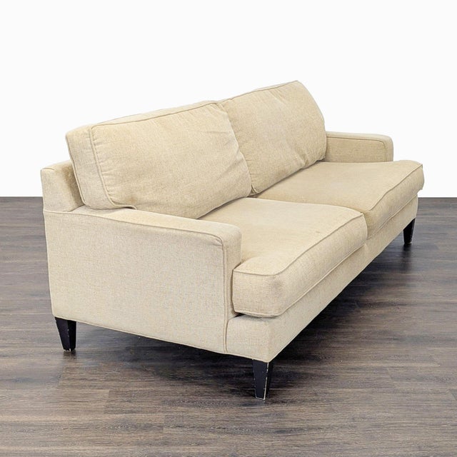 This Pier 1 Imports 3-seat sofa offers comfortable seating with plush cushions and a neutral beige fabric that fits any...