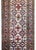 A beautiful vintage Persian Lori runner with a wonderful stylized floral pattern woven in crimson, indigo, and brown...
