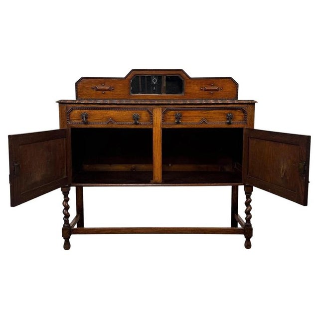 An impressive and beautifully crafted early 20th-century English Edwardian sideboard, constructed in richly coloured...