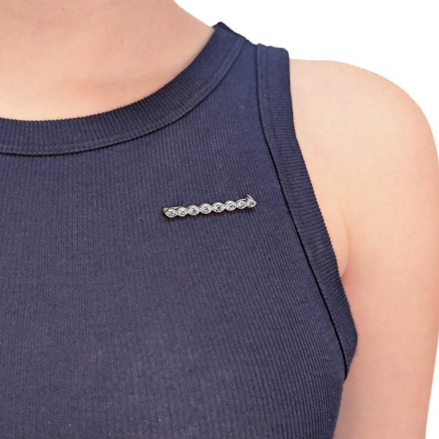 A fine antique Edwardian line brooch or bar pin. In platinum. Comprised of 8 bezel-set old marquise cut diamonds (1.64±...