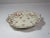 A vintage porcelain serving bowl made by the Rosenthal Co., in Germany. The bowl has a scalloped rim with pierced...