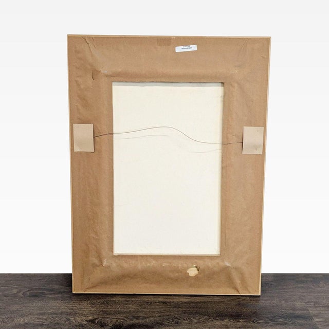 This beautiful framed print by Noel Suarez features a bouquet of white calla lilies in a brown vase, set against a warm...