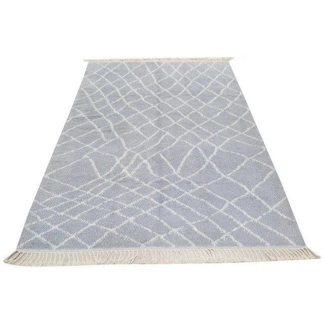 Moroccan Modern Hand-knotted with care using traditional rug-making techniques, this wool rug blends timeless...