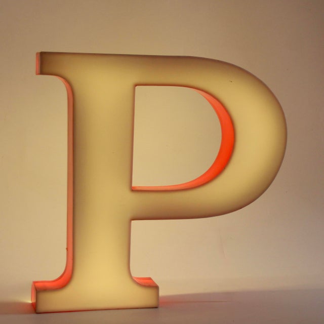 Vintage, decorative illuminated letter made of red and white acrylic glass. Fluorescent tubes replaced with energy-saving...