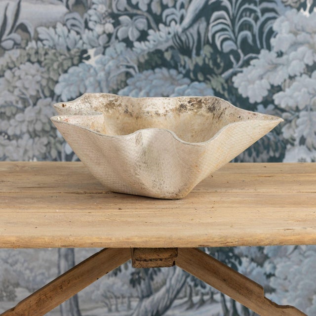 A midcentury modern Swiss clam shell planter with drainage holes by Willy Guhl. Beautiful patina. Willy Guhl (1915-2004)...