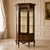 Bring timeless French elegance to your interior with this grand Louis XV-style vitrine cabinet, featuring a richly...