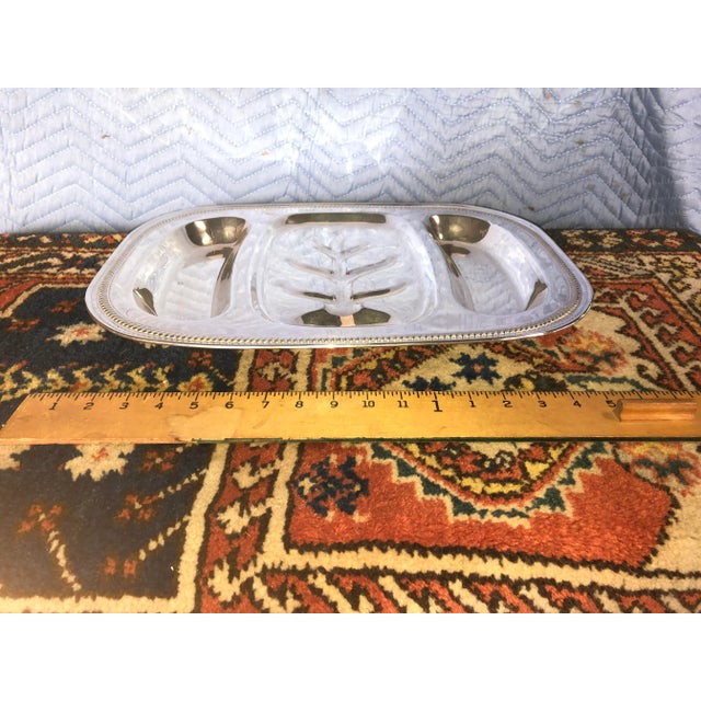 Made in the USA by English Silver Mfg Corp. is this beautifully aged meat serving dish in the Tree of Life or Well & Tree...