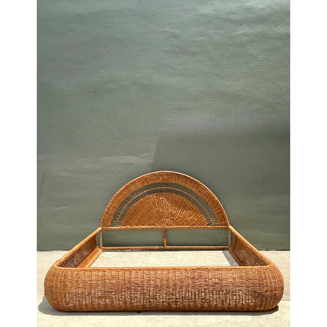 Hand-woven with remarkable artisan skill, this mid-century queen bed frame features a dramatic arching fan-shaped...