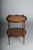 Beautiful round side table, England, 20th century The table features two round tiers; the top is embossed with leather and...