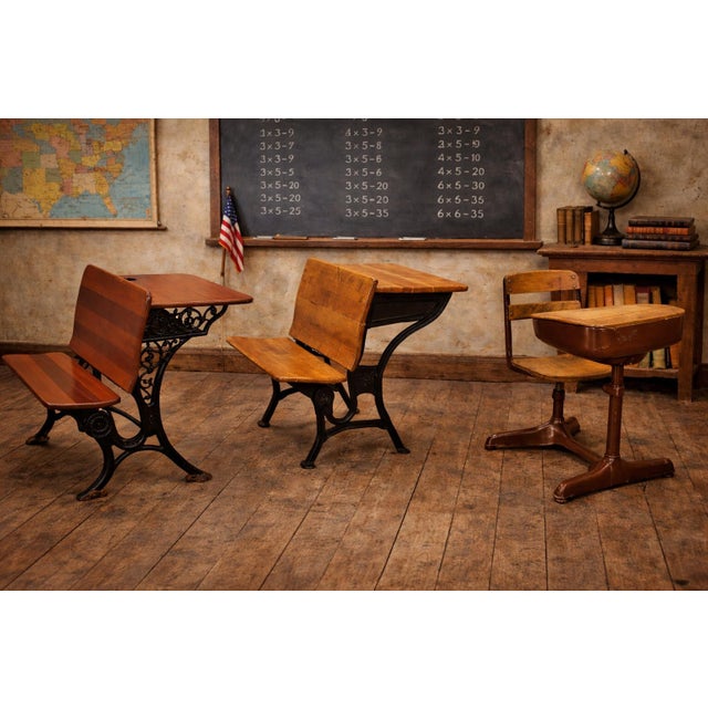 This curated set of three authentic American school desks spans the late 19th to early 20th century and illustrates the...
