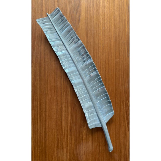 Vintage mid century pewter banana leaf serving tray in the style of Wilton Armetale Bruce Fox. 4 feet on the bottom to...