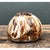 This vintage ceramic vase embraces a soft, bulbous silhouette that reads as both organic and architectural, its rounded...