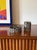 Brutalist top smoking set, ashtray, and cigarette box Morbelli Italy 1970 metal H 10 cm x 7 × 7 cm H 5 cm x 13 cm diam....