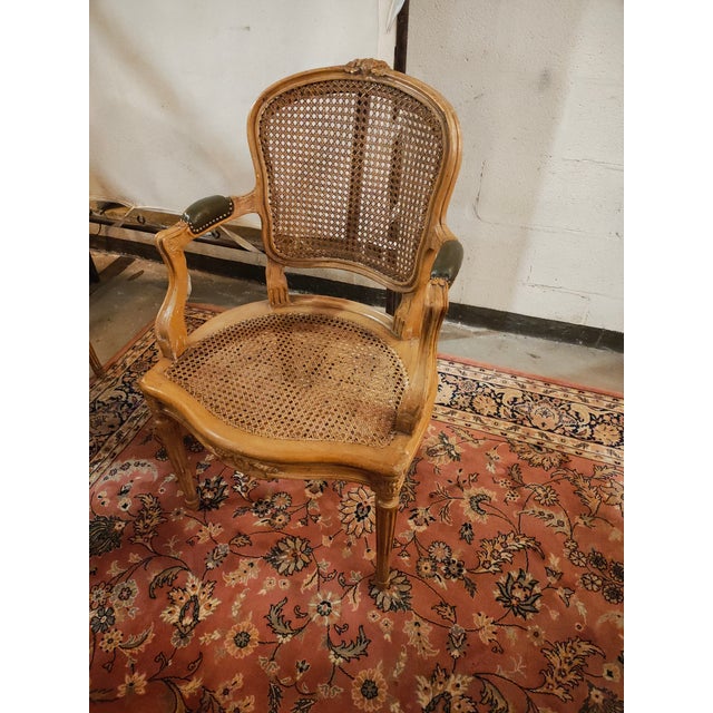 A handsome pair of late 19th century French Louis XVI style bergère armchairs crafted in carved beechwood and retaining...