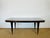 A superb art deco modernist table from the 1940s, featuring an elegant top in exotic wood veneer (macassar ebony),...
