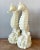 Evoke the serene beauty of the ocean with this charming pair of vintage cast resin seahorse lamps. Designed in a...
