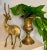 Elevate your space with this striking vintage brass antelope sculpture. Sleek lines and warm golden tones make it a...