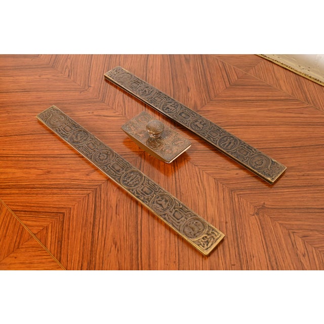 A gorgeous Art Nouveau bronze desk set. The three-piece set includes: rocker ink blotter and ink blotter ends featuring...