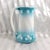 This is a teal and white pitcher or milk jug by Societe Ceramique of Halland. The pitcher is teal at the top and bottom,...