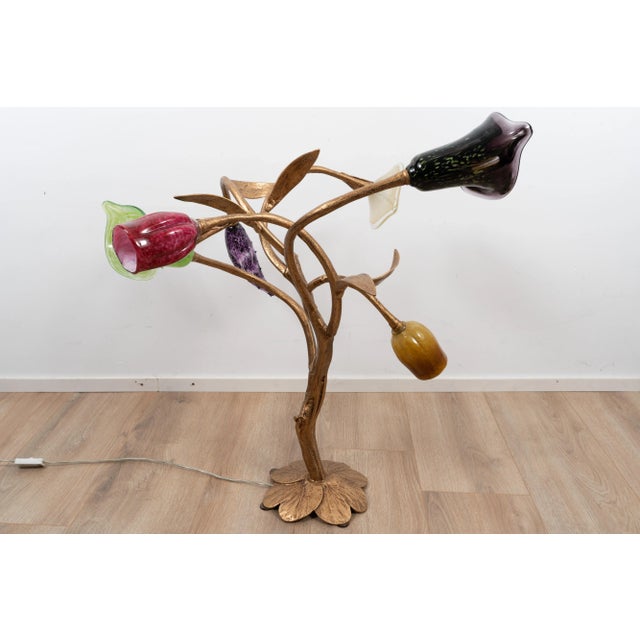 Amazing brass table light. The light comes with six individually colored and sculpted glass shades on a heavy brass frame...