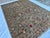This exquisite hand-knotted wool area rug features a classic Afghan Sultanabad design with a beautiful Chobi styling. The...