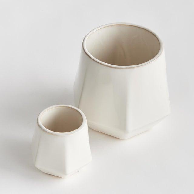 Linear in form, with a brightWhite glaze, this set of pots is pure simplicity. A lovely way to hold your favorite florals,...
