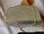 Judith Lieber minaudière clutch bag/crossbody. This clutch has sparkling rhinestones that can’t help but catch your eye....