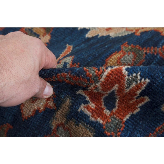 A fine example from our collection of late 19th century Persian Sultanabad antique rugs the royal blue field with...