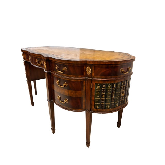 A distinguished Maitland-Smith partners desk crafted in richly figured mahogany and designed in the tradition of classic...