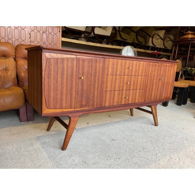 A rare Beautility sideboard from the 1960s in good used condition with age related marks, please refer to pictures....