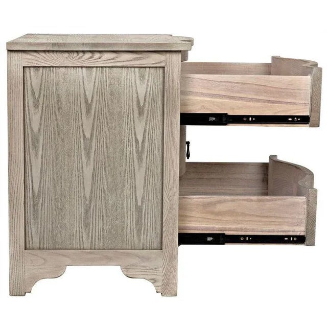 Distinguished by its three subtly curved drawers, this hand-finished vintage gray elm side table stuns from any angle,...