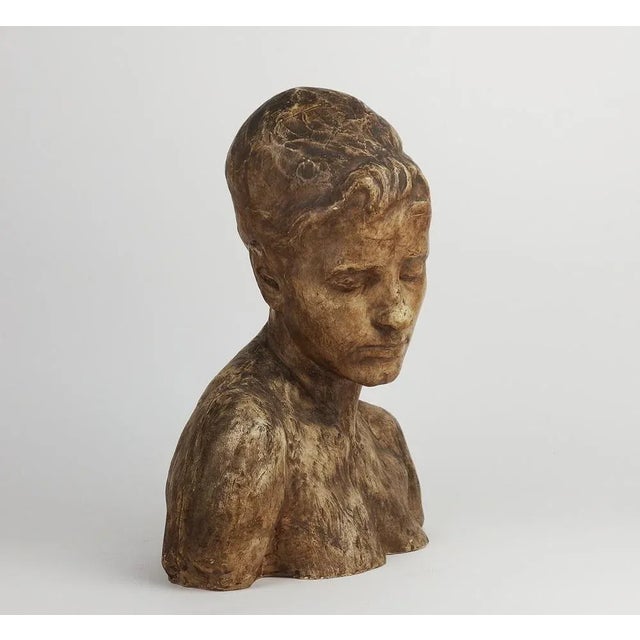 Brown patinated plaster sculpture of a young woman,France,circa 1900. Jean Pavie (1876-1928) was a French sculptor and...