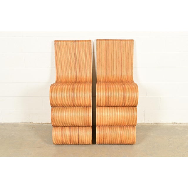 A gorgeous pair of sculptural Organic Modern pencil reed rattan bar stools In the manner of Gabriella Crespi Italy, Circa...