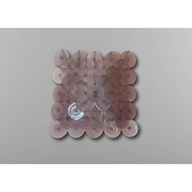 Large iridescent Murano glass disc wall light Murano, Italy 1960. The wall light rests on a nickel-plated metal structure...