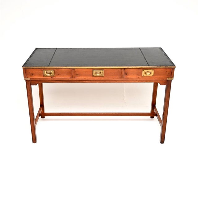 A wonderful antique military campaign style desk in yew wood, dating from around the 1950’s period. It is of excellent...