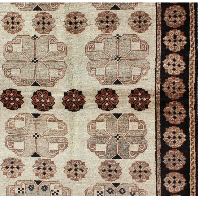 Measures: 4'10 x 7'4. Vintage Persian Gabbeh Rug with Repeating Geometric Rosettes 4'10 x 7'4. Keivan Woven Arts / rug...