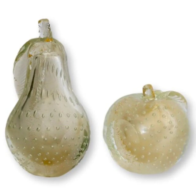 Some decor whispers. These hold the room. Handblown in midcentury Murano with suspended gold flake and soft champagne...