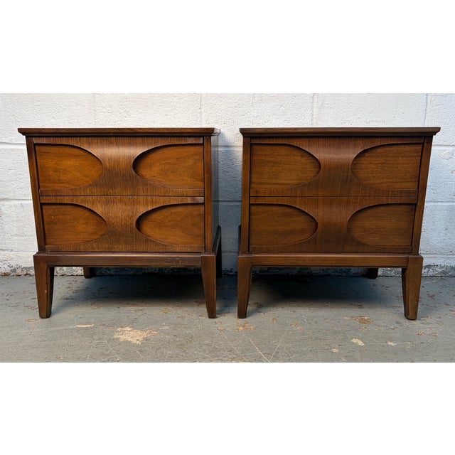 Add character and timeless style to your bedroom with this pair of Mid-20th Century Sculpted Walnut Nightstands,...
