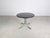 We are offering a beautiful Italian mid-century dining table from the 1970s for sale. The table features a round, black...