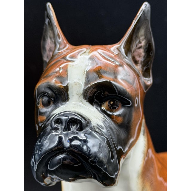 German Goebel Boxer dog, 1973, made of porcelain with a glossy enamel finish. The figurine features a brindle color with a...