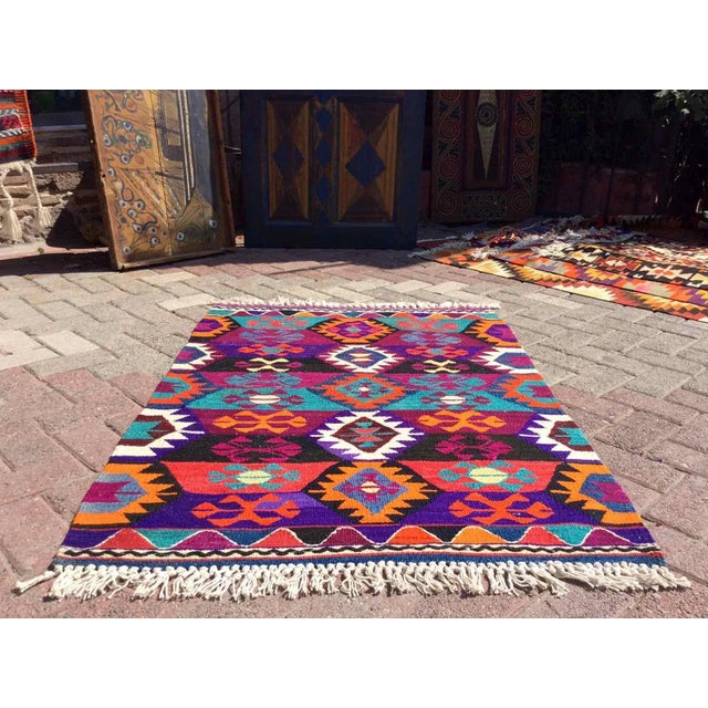This beautiful, vintage, handwoven Kilim is approximately 60 years old. It is handmade of very fine quality, wool and...