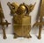 Vintage Gold 3 piece wall hanging, made by Sexton. Center 10.5”h x 13.5”W, swords 9”w x 25.5”H.