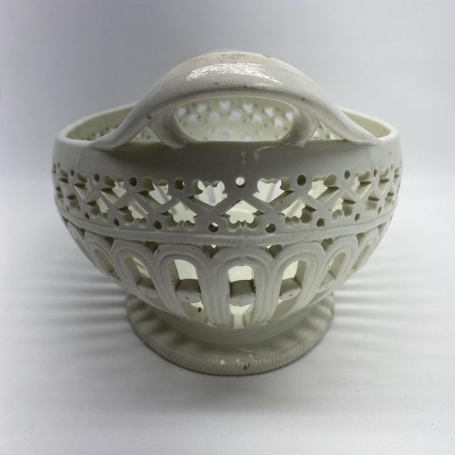 Antique 18th century George III Shorthose creamware basket with intricate pierced sides and loop handles. Measures 10 3/8"...