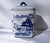 Elegant blue and white porcelain canister with classic scenic motif. Features deep blue hand-painted landscape details for...
