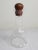 This is a beautiful tall decanter made of clear blown glass with an oiled teak stopped in excellent condition. It was...
