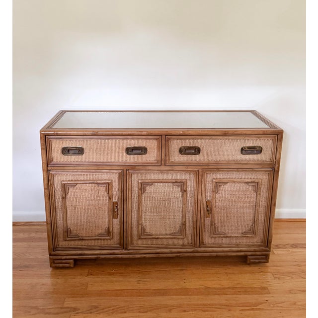 Beautiful vintage Drexel bamboo, wood, rattan, woven cane wicker, brass cabinet credenza buffet dresser. Comes with inset...