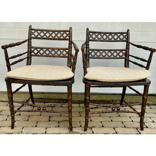 Great pair of vintage armchairs by Baker Furniture. Faux-bamboo frame with caned seats, trellis carved backsplash, hand...